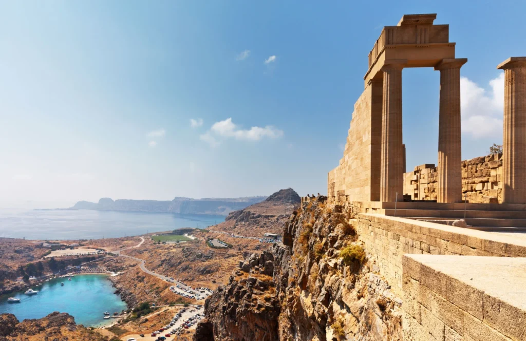 Luxury yacht cruising near Rhodes in the Dodecanese Islands, Greece, with ancient ruins, crystal-clear Aegean waters, and scenic coastal views