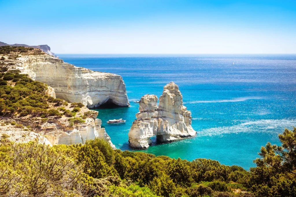 Luxury yacht sailing among the Cyclades Islands, Greece, with iconic whitewashed villages, azure waters, and breathtaking island vistas