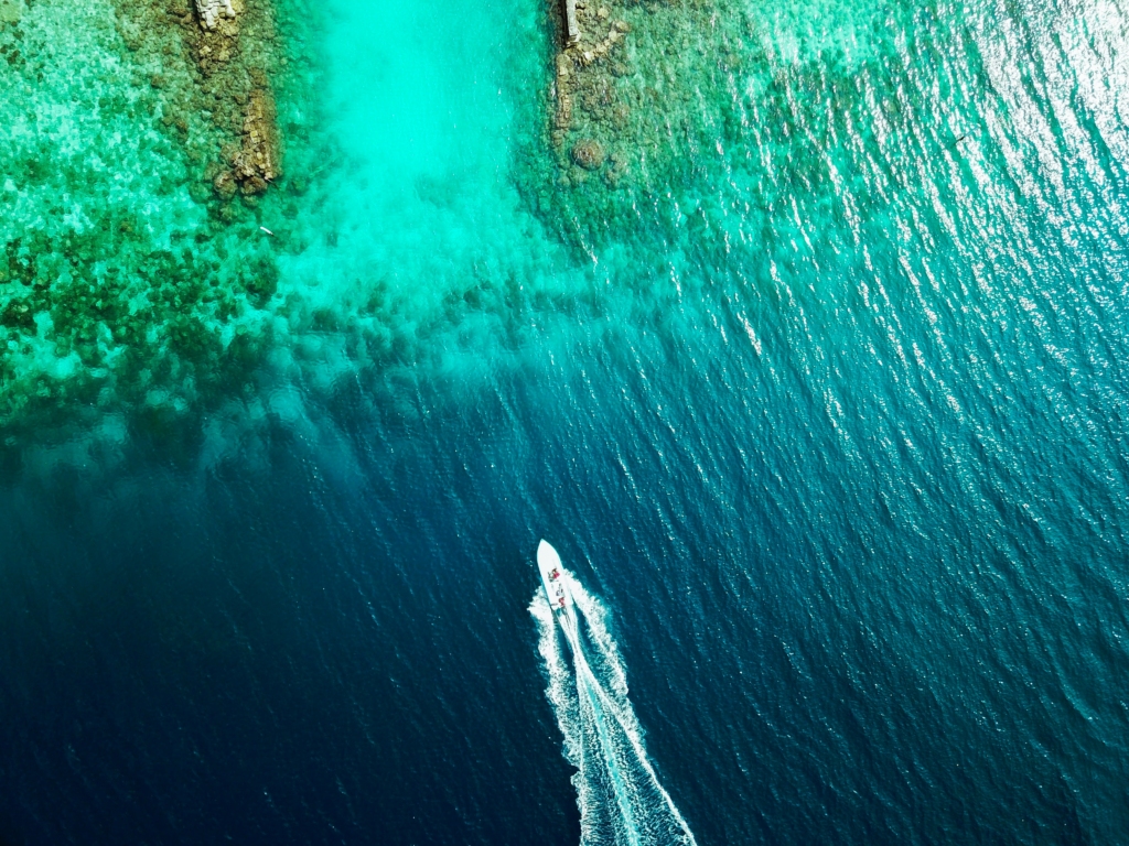 Luxury yacht cruising near Protaras, Cyprus, with turquoise Mediterranean waters, pristine beaches, and scenic coastal views.