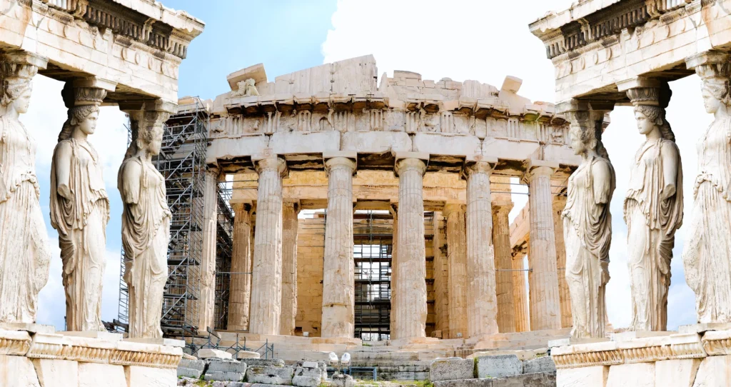 Luxury yacht cruising near Athens with ancient ruins in the distance and calm Saronic Gulf waters, blending modern charm and historic allure