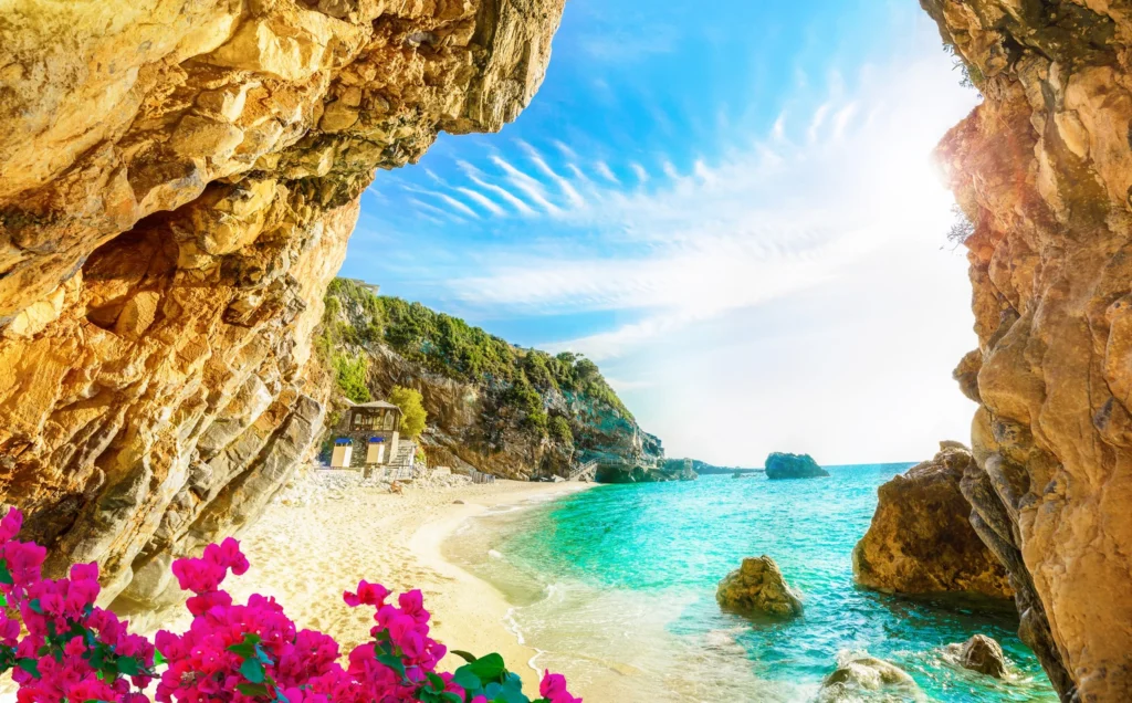Luxury yacht cruising near Corfu with clear Ionian Sea waters, lush greenery, and picturesque coastal scenery in Greece.