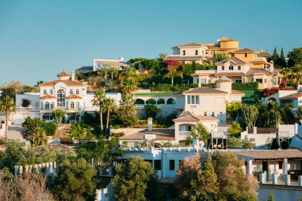 Luxury yacht cruising near Fuengirola, Spain, with crystal-clear Mediterranean waters, vibrant marina, and scenic coastal views