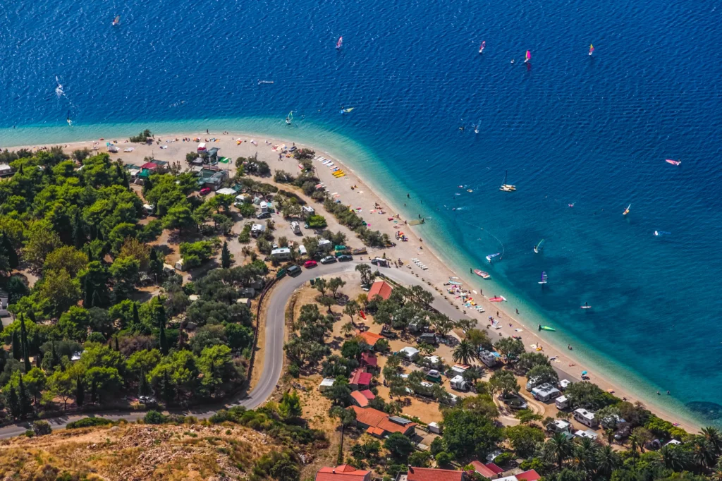 Luxury yacht cruising near Korčula, Croatia, with turquoise Adriatic waters, historic coastal charm, and scenic island vistas.