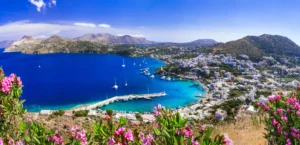 Luxury yacht cruising near Leros in the Dodecanese Islands, Greece, with clear Mediterranean waters, charming coastal villages, and lush landscapes.