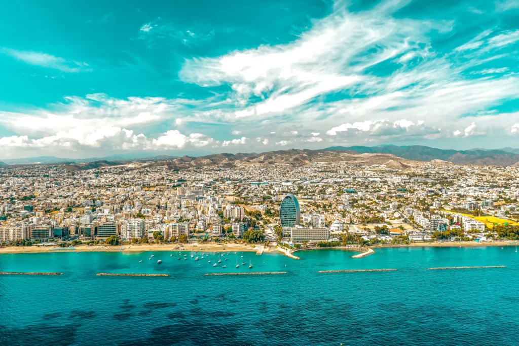 Luxury yacht cruising near Limassol, Cyprus, with sparkling Mediterranean waters, a modern marina, and scenic coastal views.