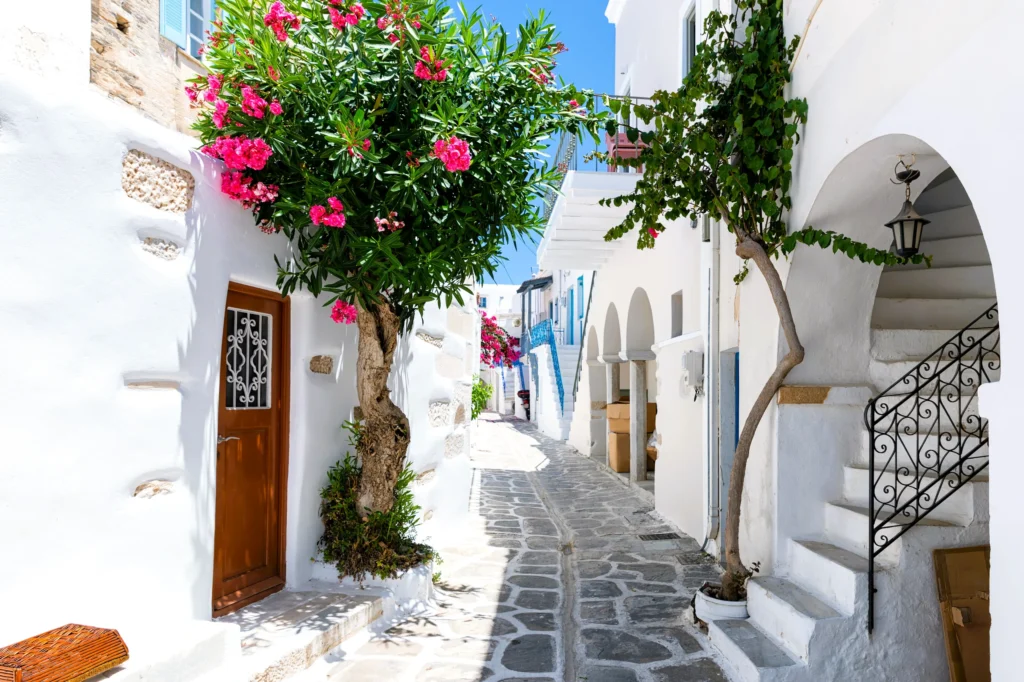 Luxury yacht cruising near Paros in the Cyclades Islands, Greece, with sparkling Aegean waters, charming whitewashed villages, and scenic coastlines