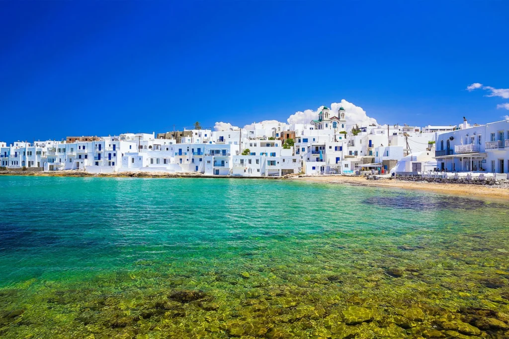 Luxury yacht cruising near Paros in the Cyclades Islands, Greece, with sparkling Aegean waters, charming whitewashed villages, and scenic coastlines