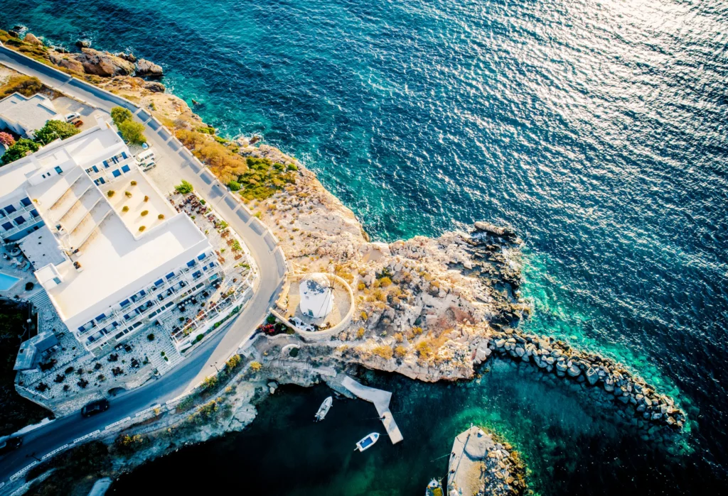 Luxury yacht cruising near Paros in the Cyclades Islands, Greece, with sparkling Aegean waters, charming whitewashed villages, and scenic coastlines