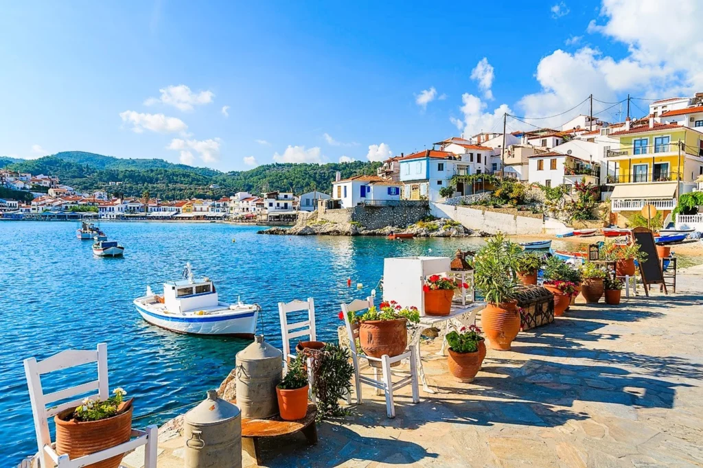 Luxury yacht cruising near Patmos in the Dodecanese Islands, Greece, with pristine blue waters, rugged coastlines, and ancient ruins.