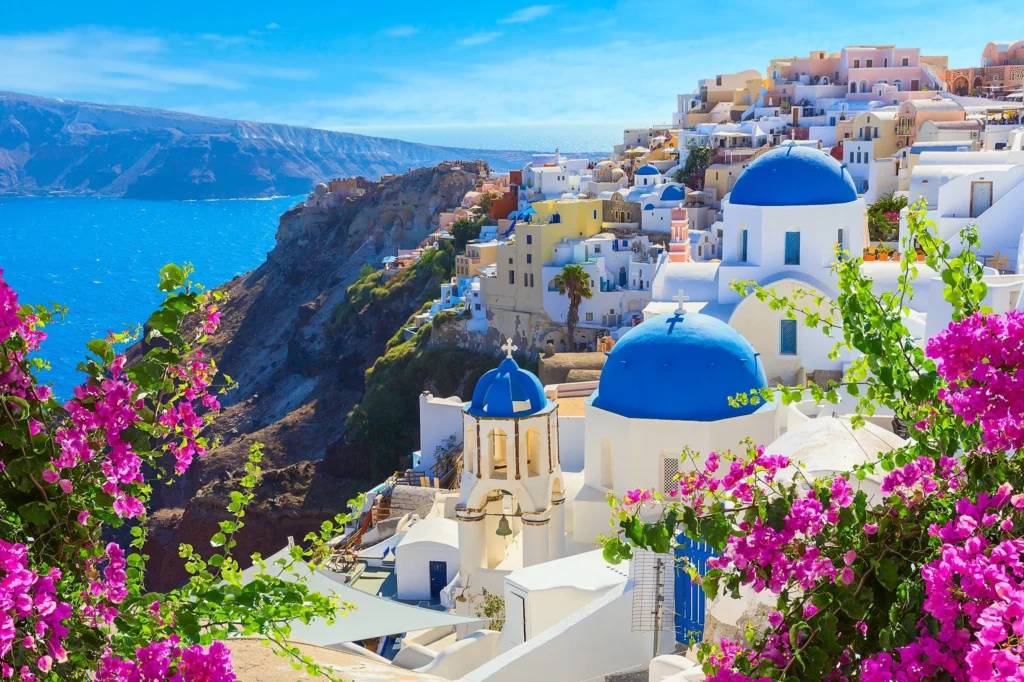 Luxury yacht cruising near Santorini in the Cyclades Islands, Greece, with breathtaking caldera views, whitewashed villages, and sparkling Aegean waters.