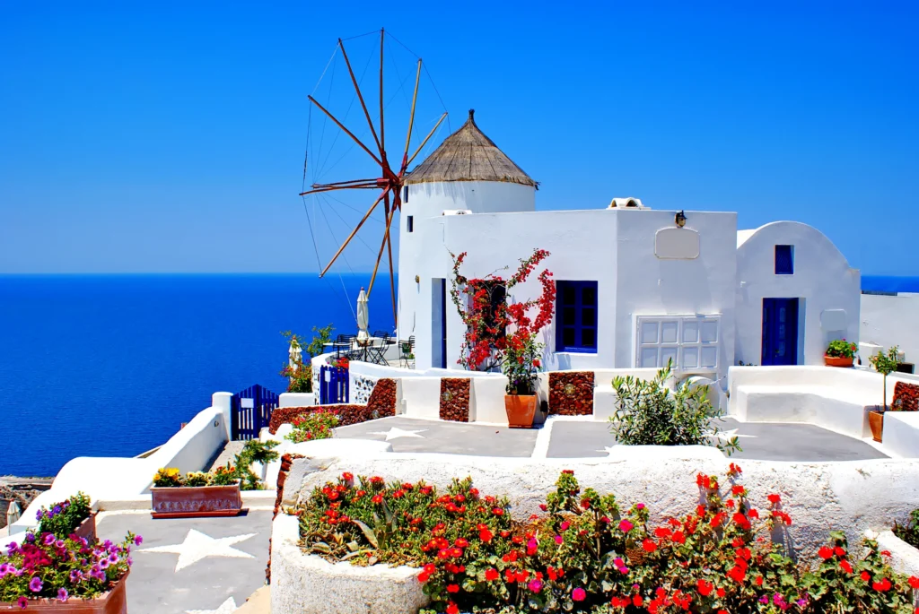 Luxury yacht cruising near Santorini in the Cyclades Islands, Greece, with breathtaking caldera views, whitewashed villages, and sparkling Aegean waters.