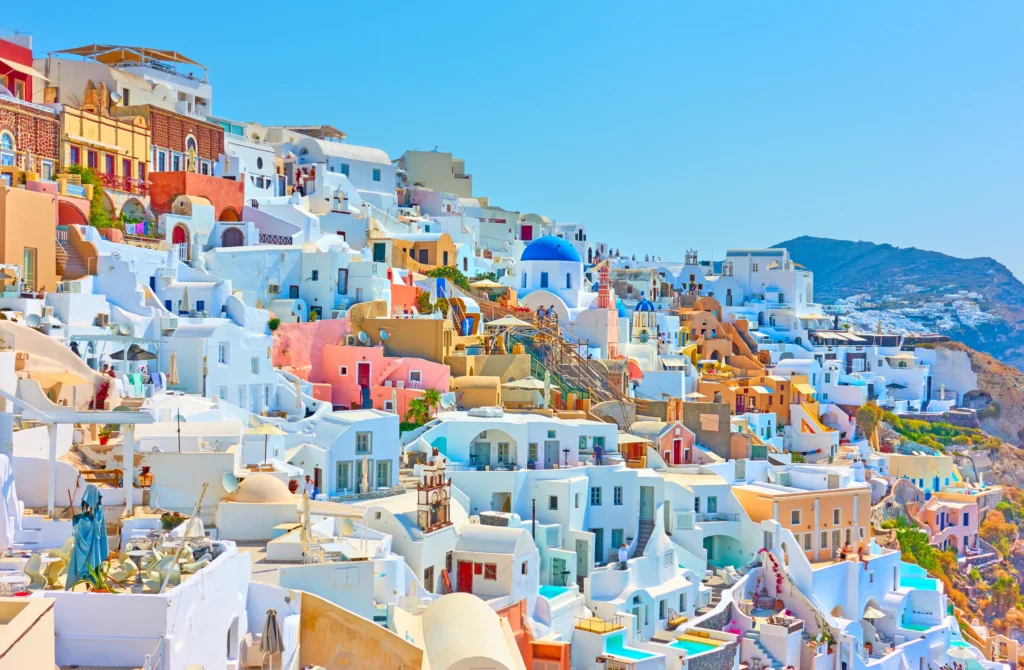 Luxury yacht cruising near Santorini in the Cyclades Islands, Greece, with breathtaking caldera views, whitewashed villages, and sparkling Aegean waters.