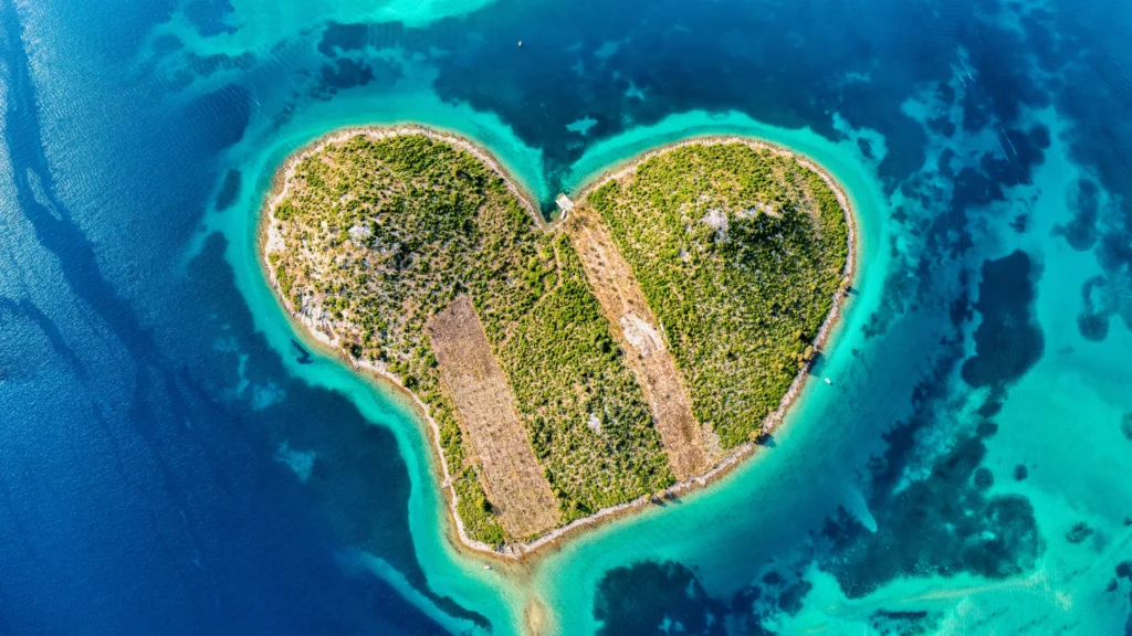 Luxury yacht cruising near Zadar, Croatia, with clear Adriatic waters, historic cityscapes, and picturesque coastal views.