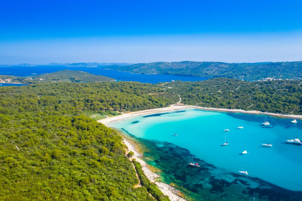 Luxury yacht cruising near Zadar, Croatia, with clear Adriatic waters, historic cityscapes, and picturesque coastal views.