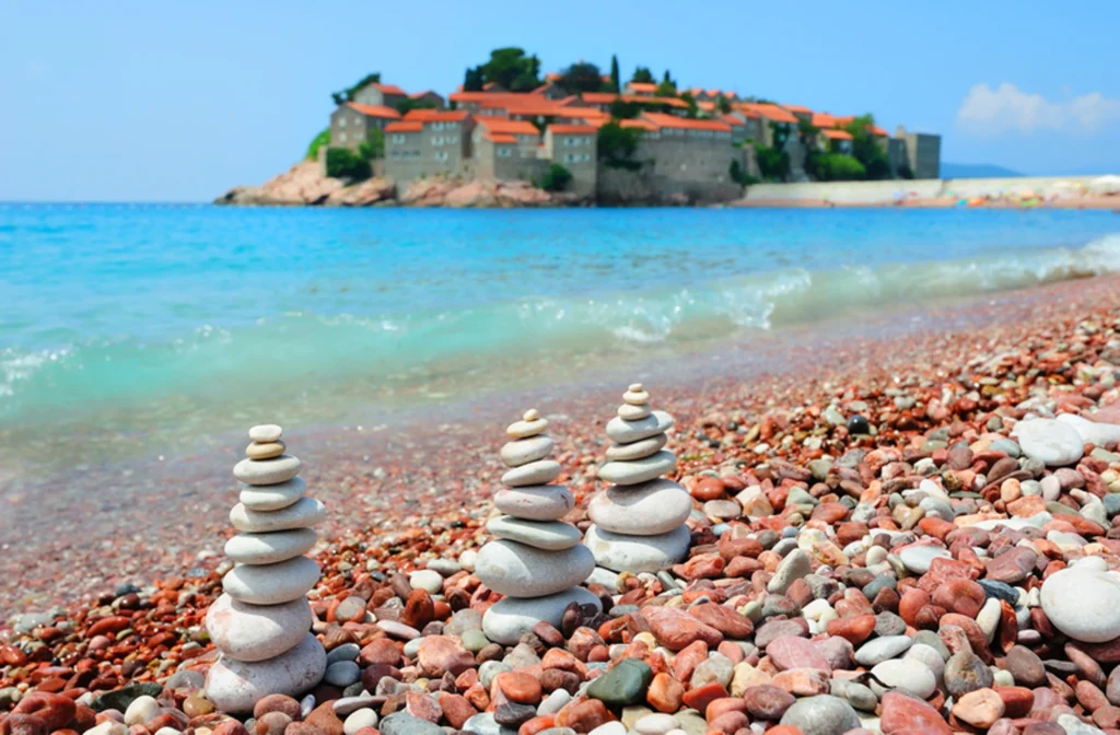 Luxury yacht cruising near Budva, Montenegro, with sparkling Adriatic waters, historic coastal charm, and vibrant marinas.