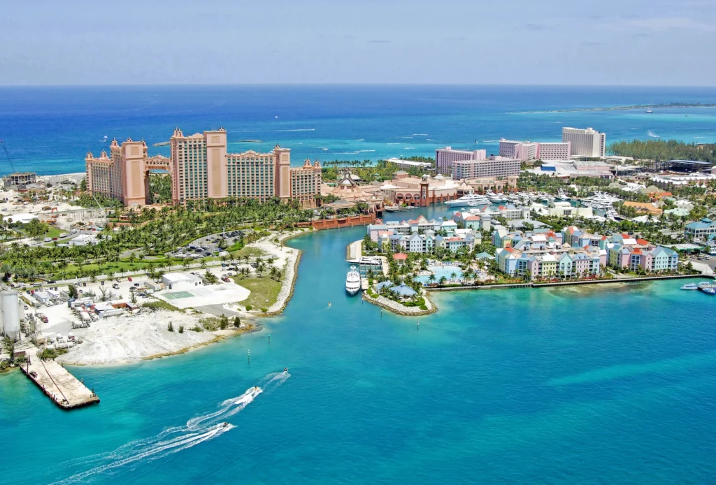 Luxury yacht cruising near Nassau in the Bahamas, with vibrant turquoise waters, pristine beaches, and dynamic Caribbean scenery.