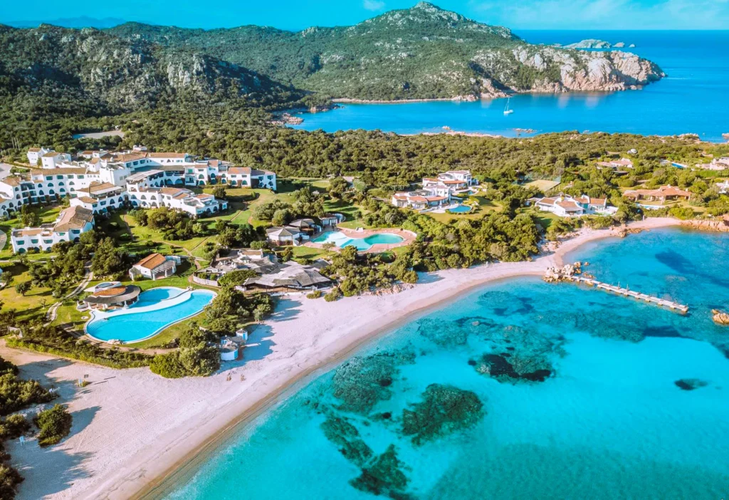 Luxury yacht cruising near Porto Cervo, Sardinia, Italy, with turquoise waters, glamorous marinas, and stunning Mediterranean scenery.