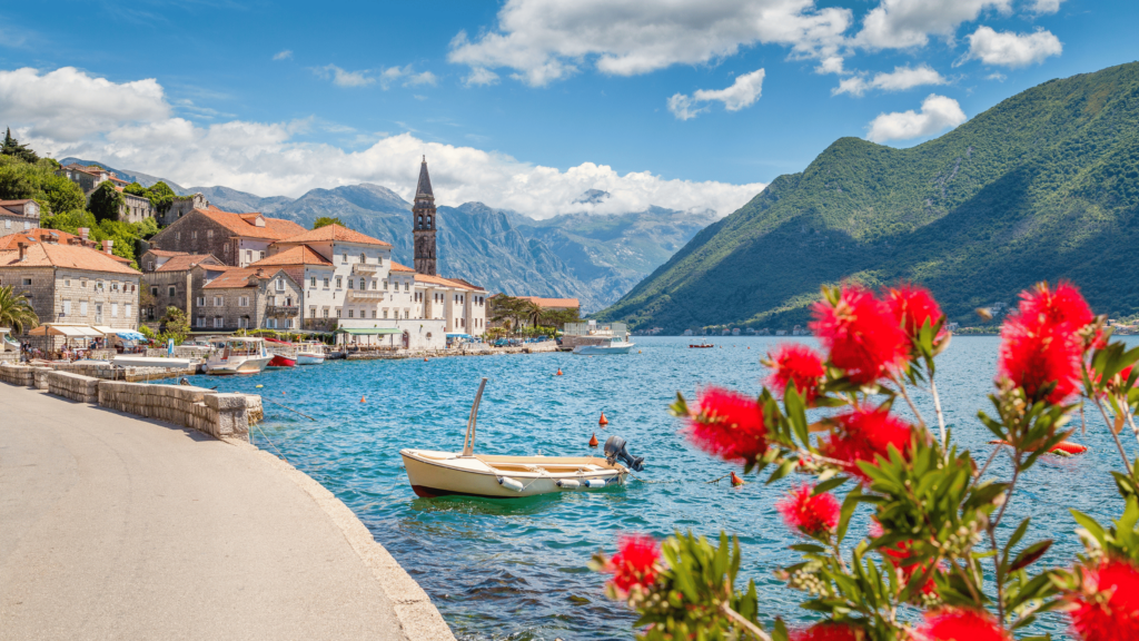 Luxury yacht cruising near Tivat, Montenegro, with clear Adriatic waters, sophisticated marinas, and stunning coastal views."