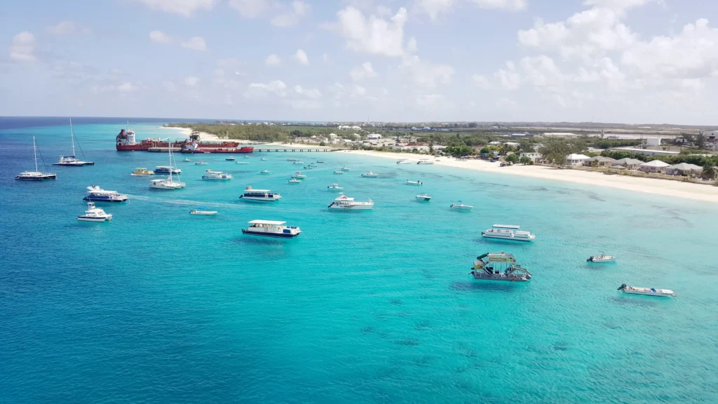 Luxury yacht cruising in the Turks & Caicos, with crystal-clear turquoise waters, pristine white beaches, and vibrant marine life, ideal for exclusive yacht charters.