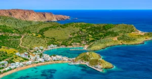 Luxury yacht anchored near Kythira, Greece, with turquoise waters, dramatic cliffs, and serene island landscapes.